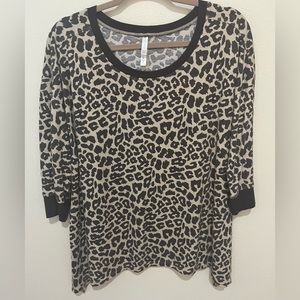 Cute Lularoe cheetah print, shark bite hem tunic top